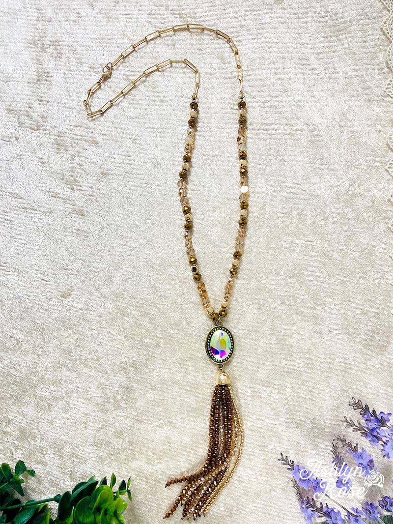 CRASH MY PARTY OVAL IRIDESCENT CRYSTAL BEADED TASSEL PENDANT ON A CRYSTAL BEADED GOLD LINKED CHAIN NECKLACE, BROWN